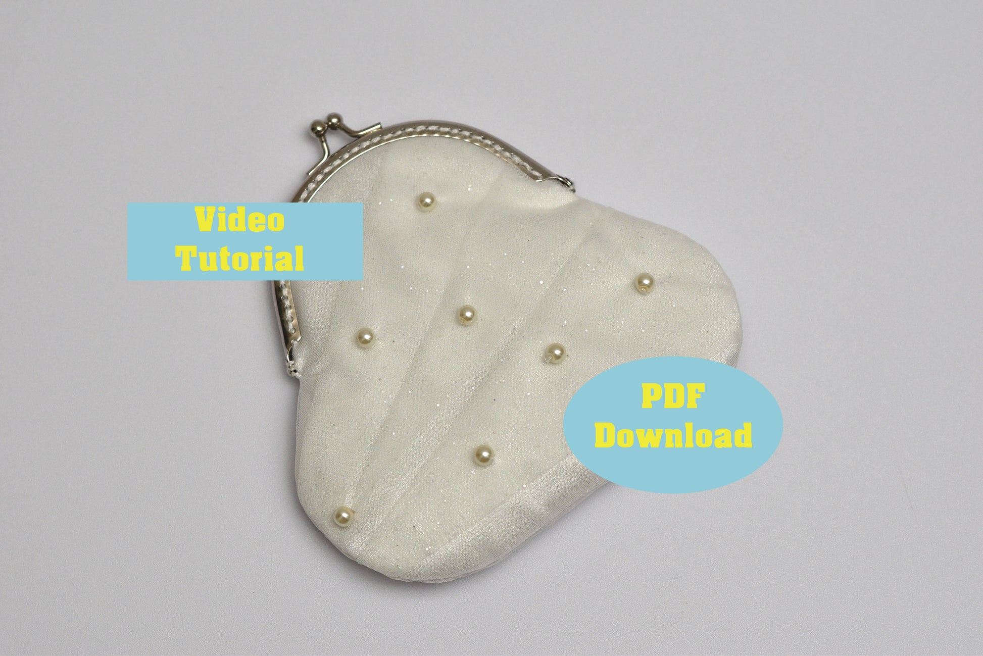 Heart-shaped pouch with pearl embellishments on a gray background, accompanied by text for video tutorial and PDF download.