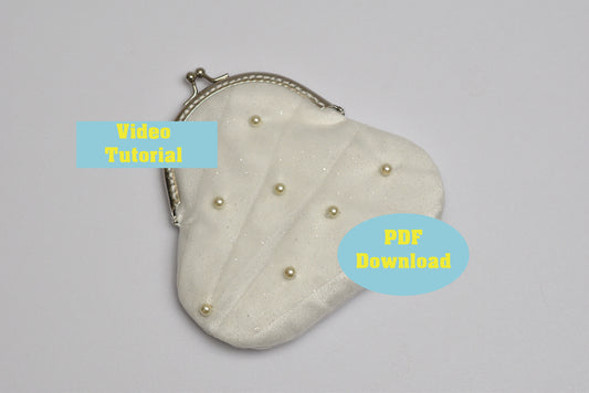 Heart-shaped pouch with pearl embellishments on a gray background, accompanied by text for video tutorial and PDF download.