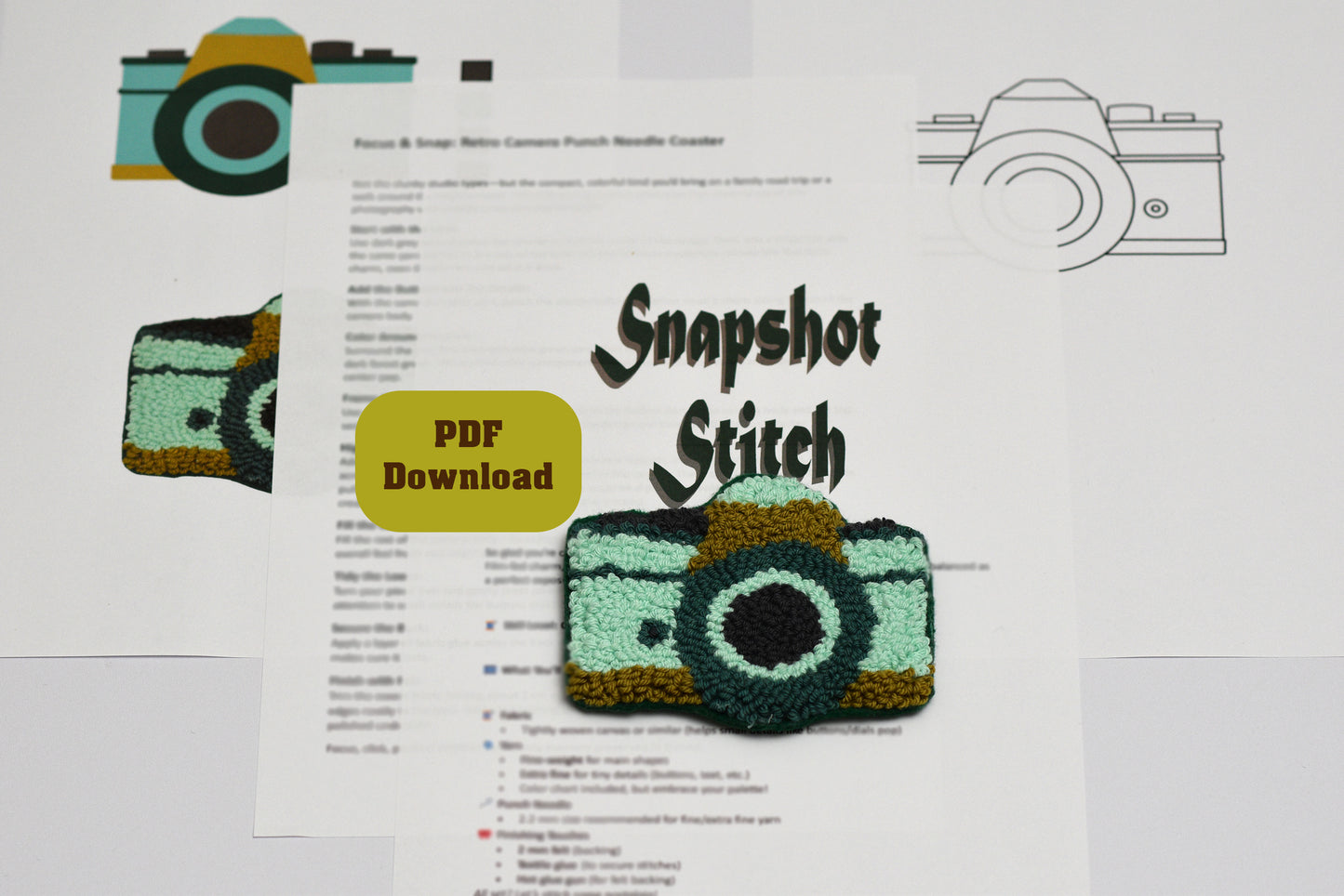 Embroidered retro camera coaster pattern with 'Snapshot Stitch' branding on a white background