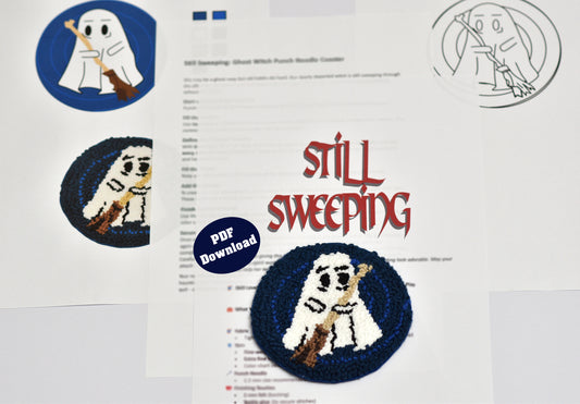 Embroidery coaster design with ghost character and text 'Still Sweeping' on a white background