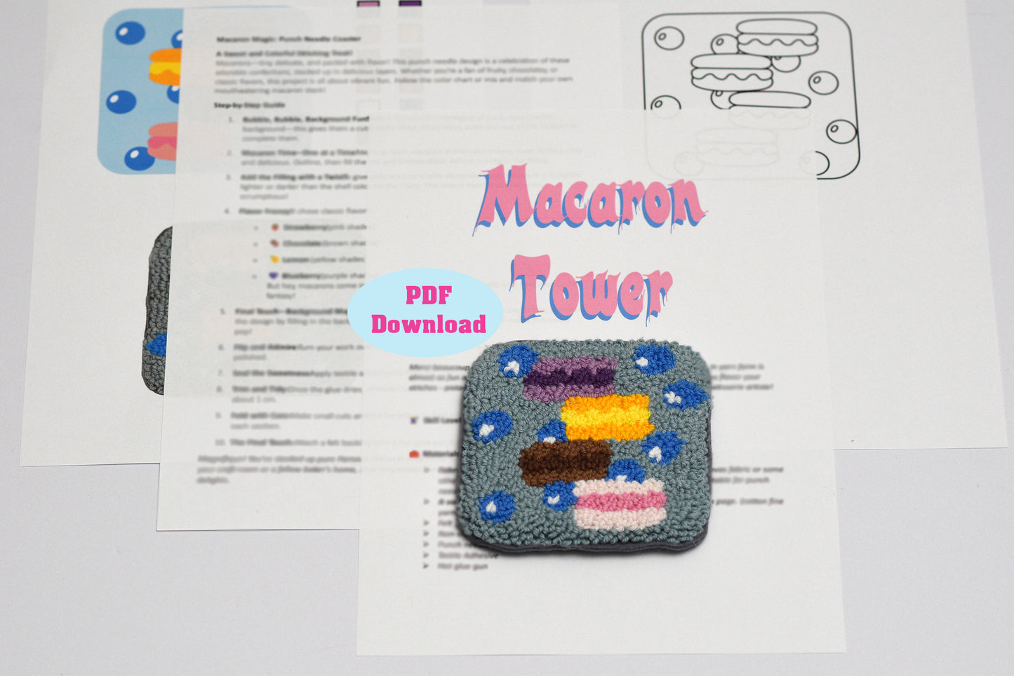 Embroidered coaster design of a macaron tower with a PDF download label on a white background