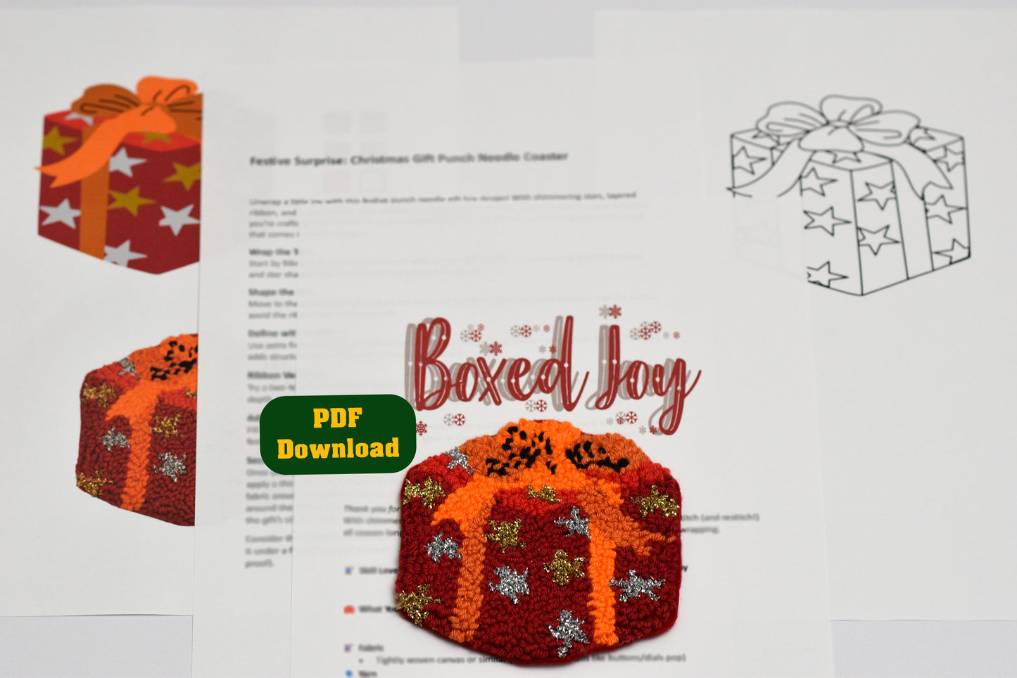 Punch needled coaster with gift box design with 'Boxed Joy' text and PDF download button on a white background