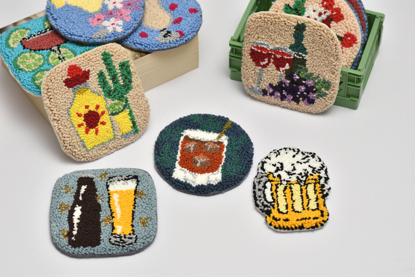 Set of colorful coasters with various designs of drinks on a light gray background