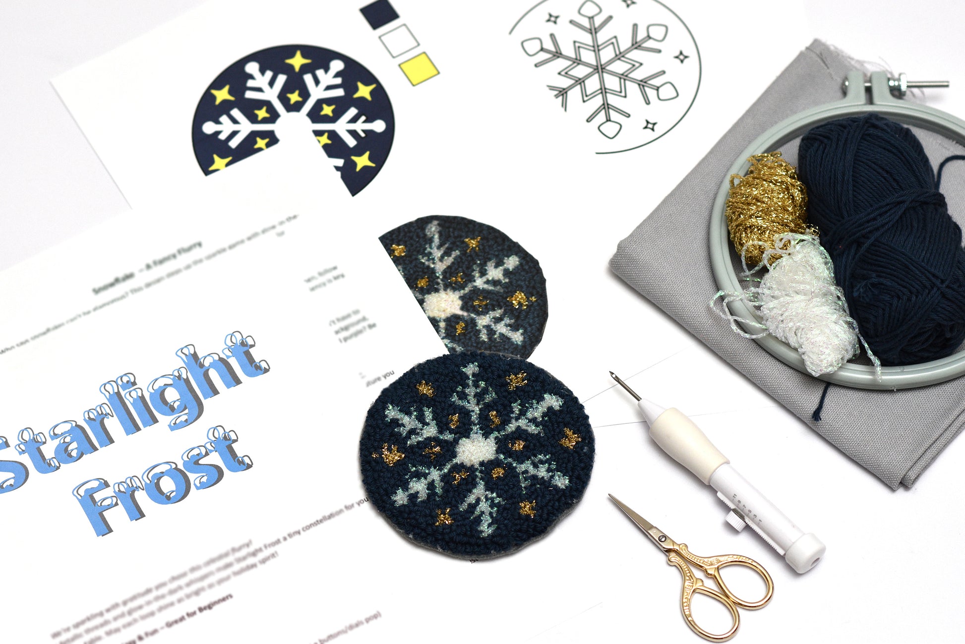 Embroidery coaster kit with starlight design, yarn, scissors, and a candle on a white background.