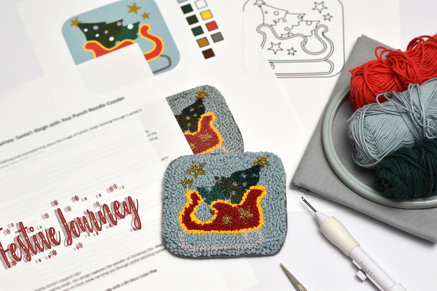 Decorative punch needle coaster project with yarn and templates on a table