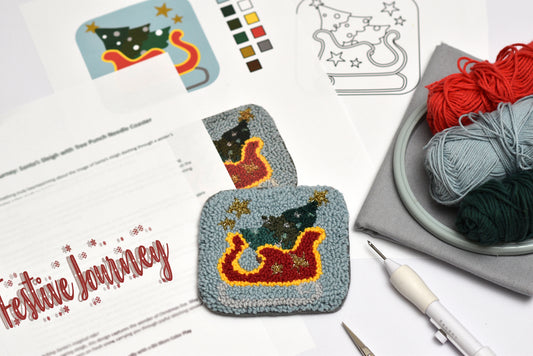 Decorative punch needle coaster project with yarn and templates on a table