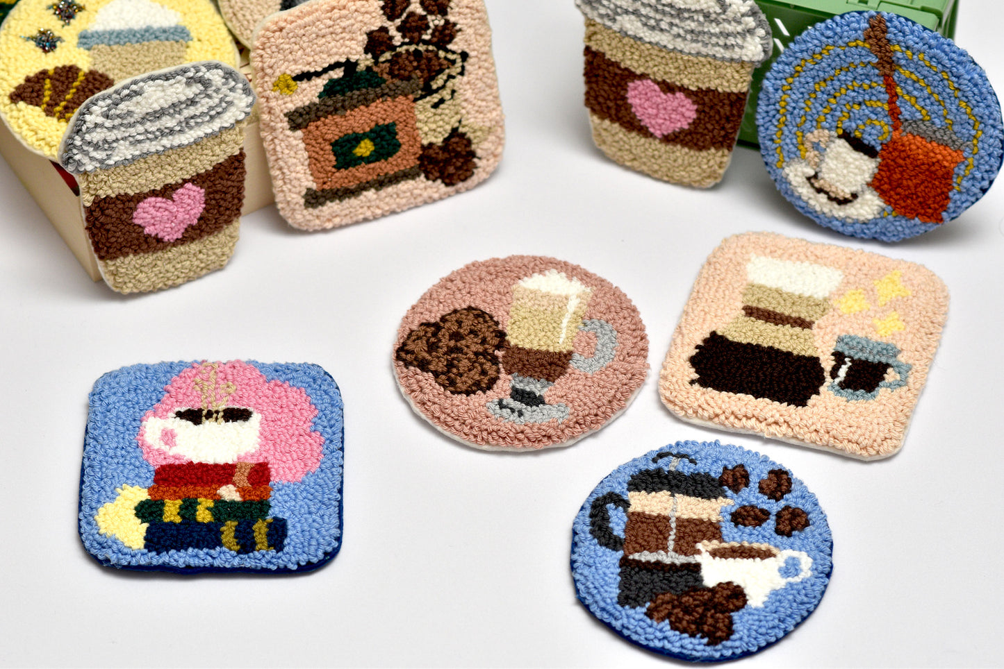 Set of colorful coffee themed coasters with various designs on a white background