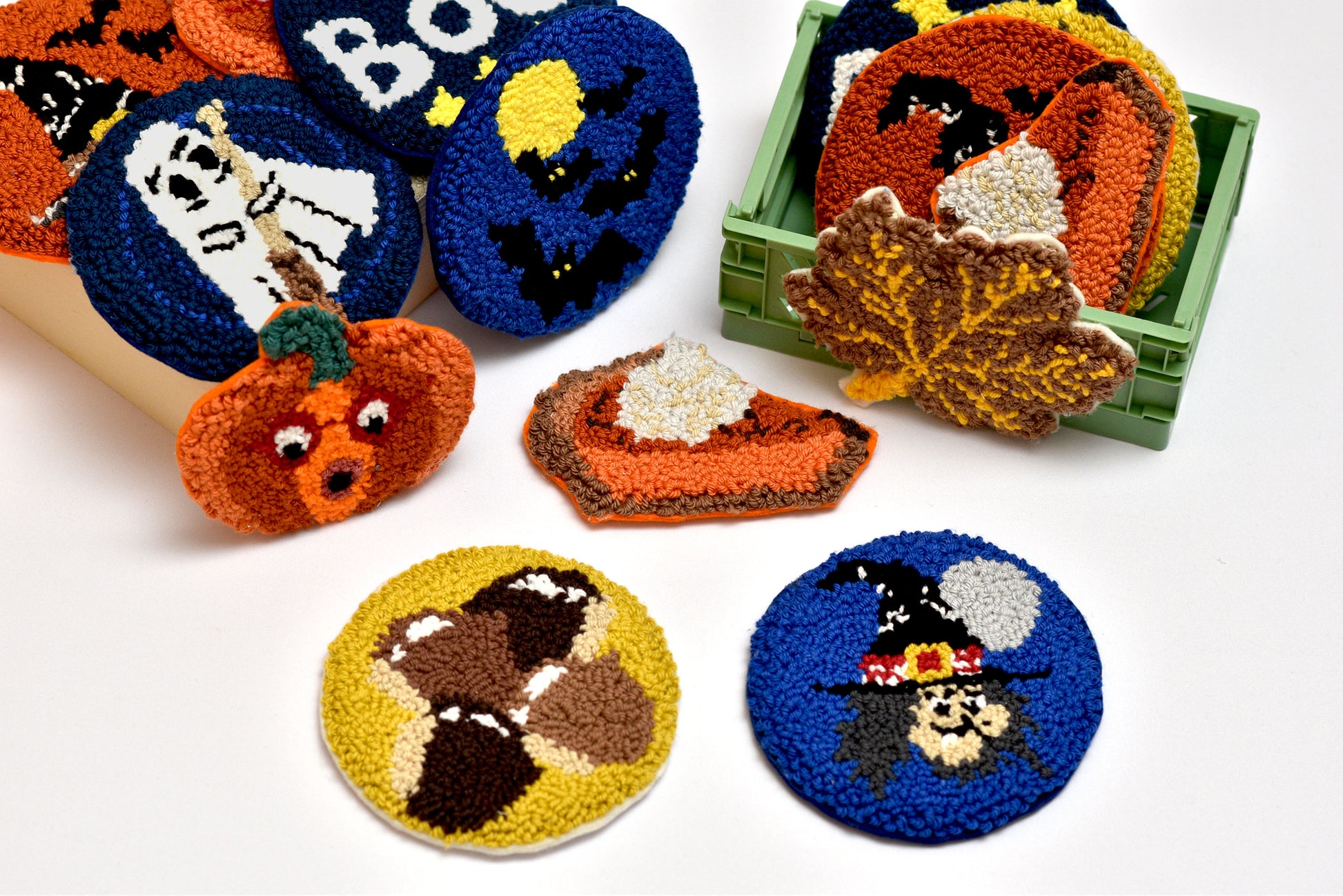 Collection of Halloween-themed embroidered coasters on a white background