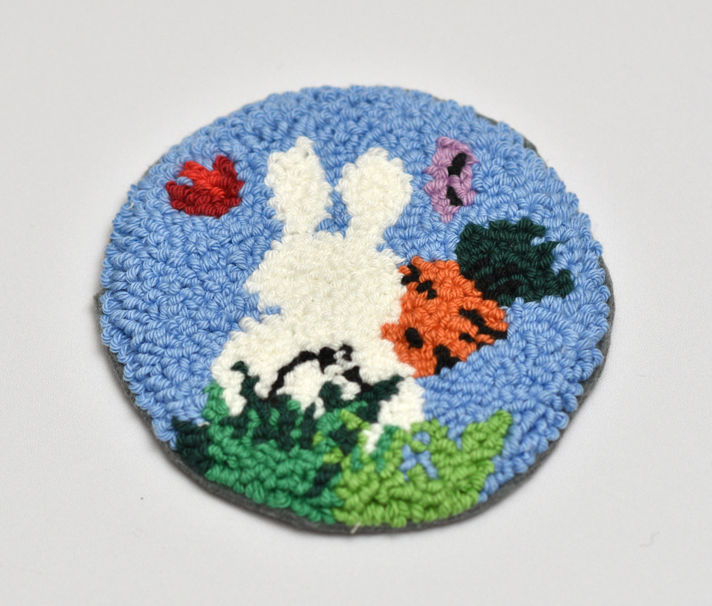 Round rug with an Easter rabbit design on a white background