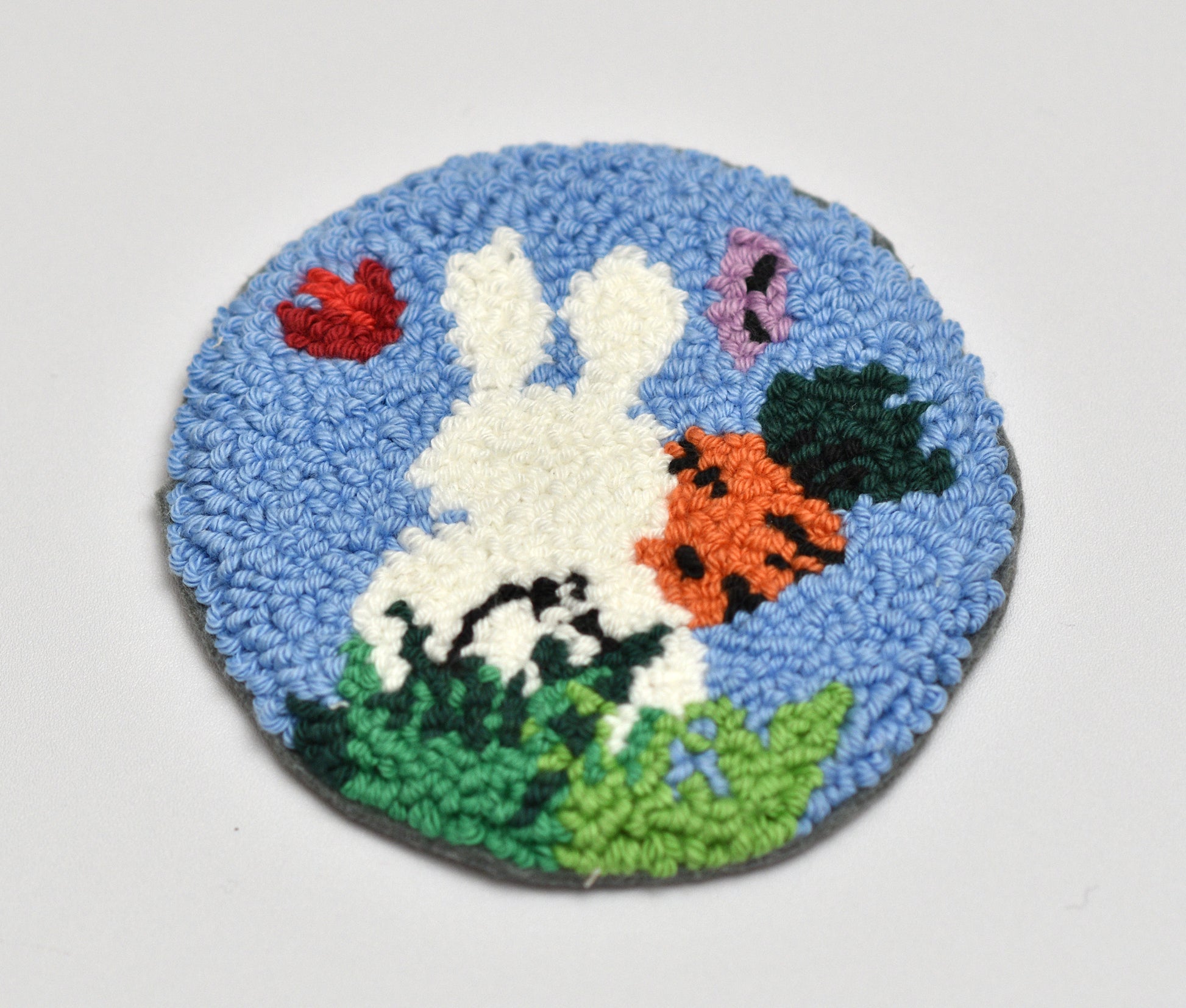 Round rug with an Easter rabbit design on a white background