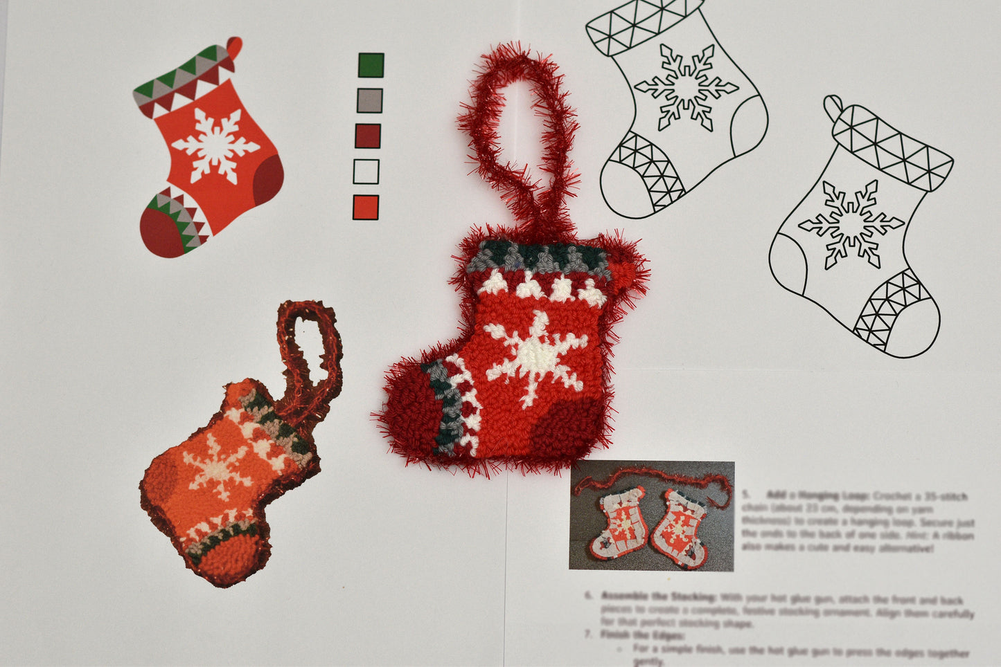Punch needled Christmas stockings with snowflake designs on a white background