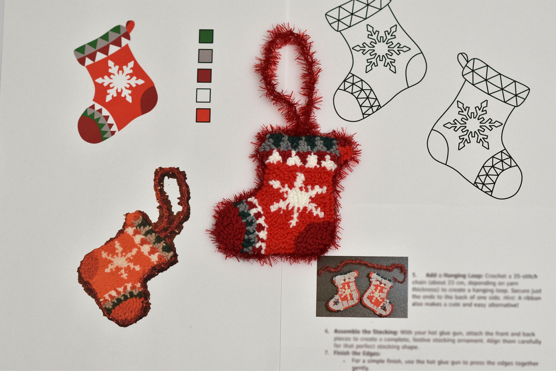 Punch needled Christmas stockings with snowflake designs on a white background