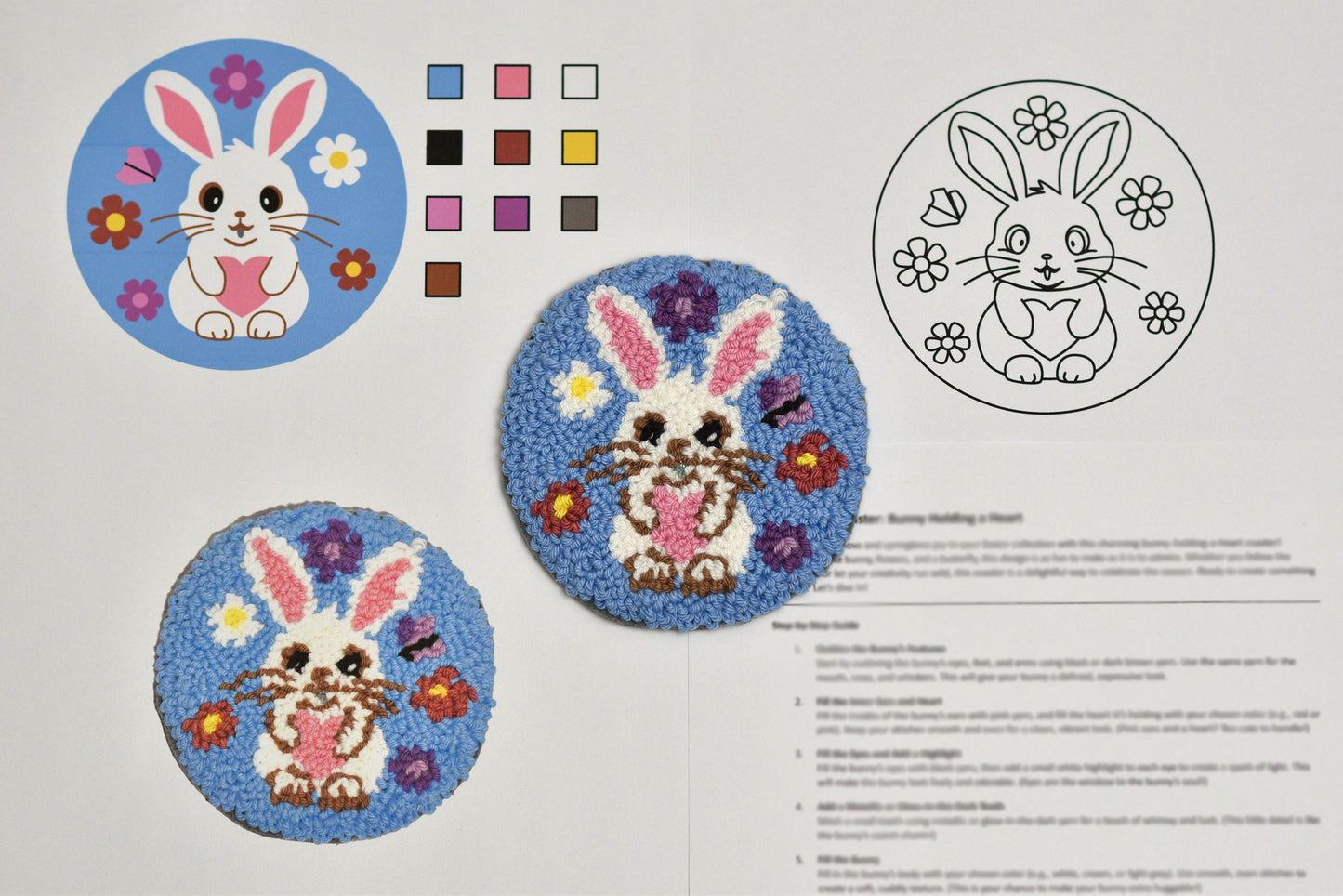 Embroidery pattern with bunny designs and color swatches on a white background