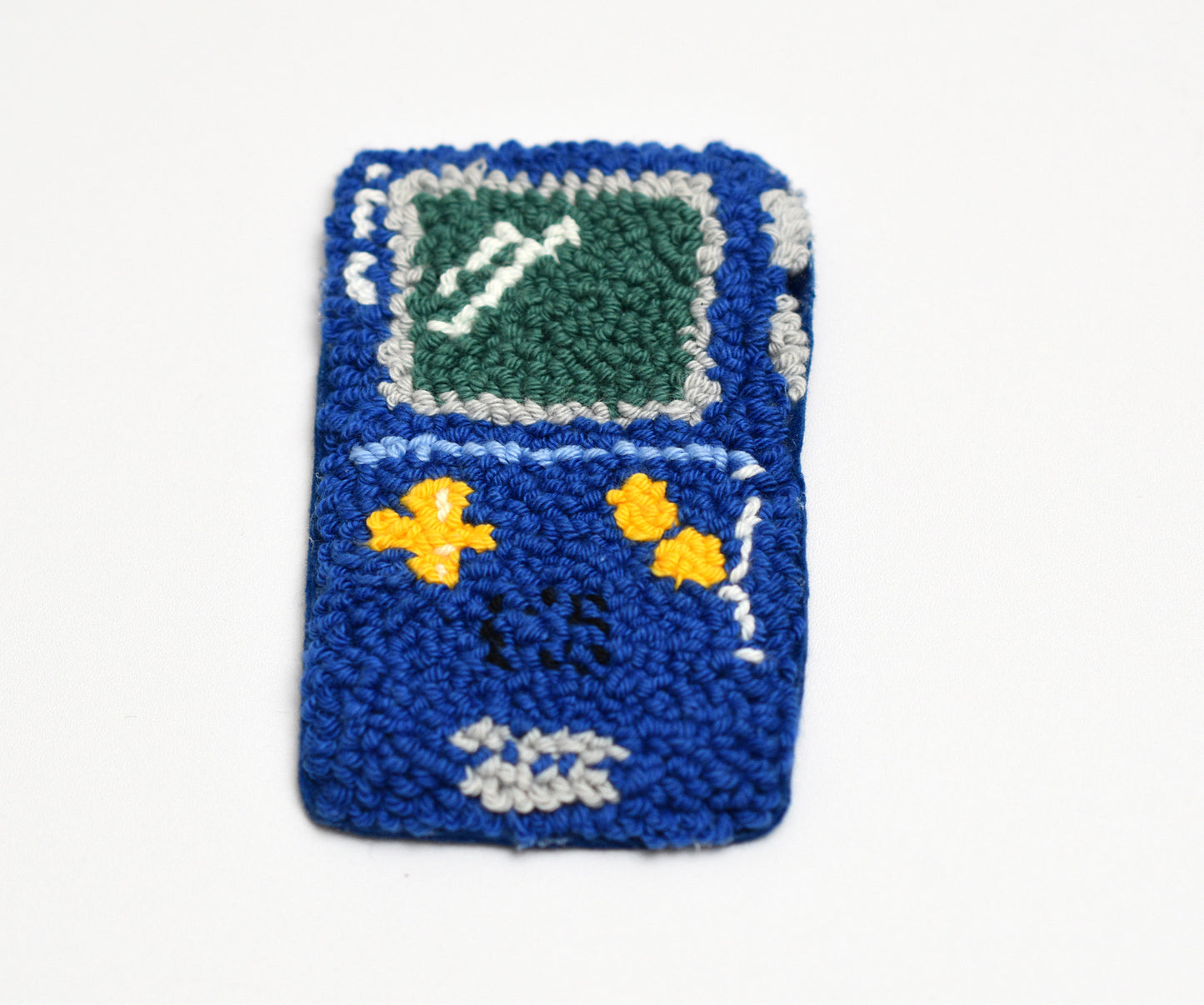 Punch needle blue Game boy coaster with a screen design on a white background