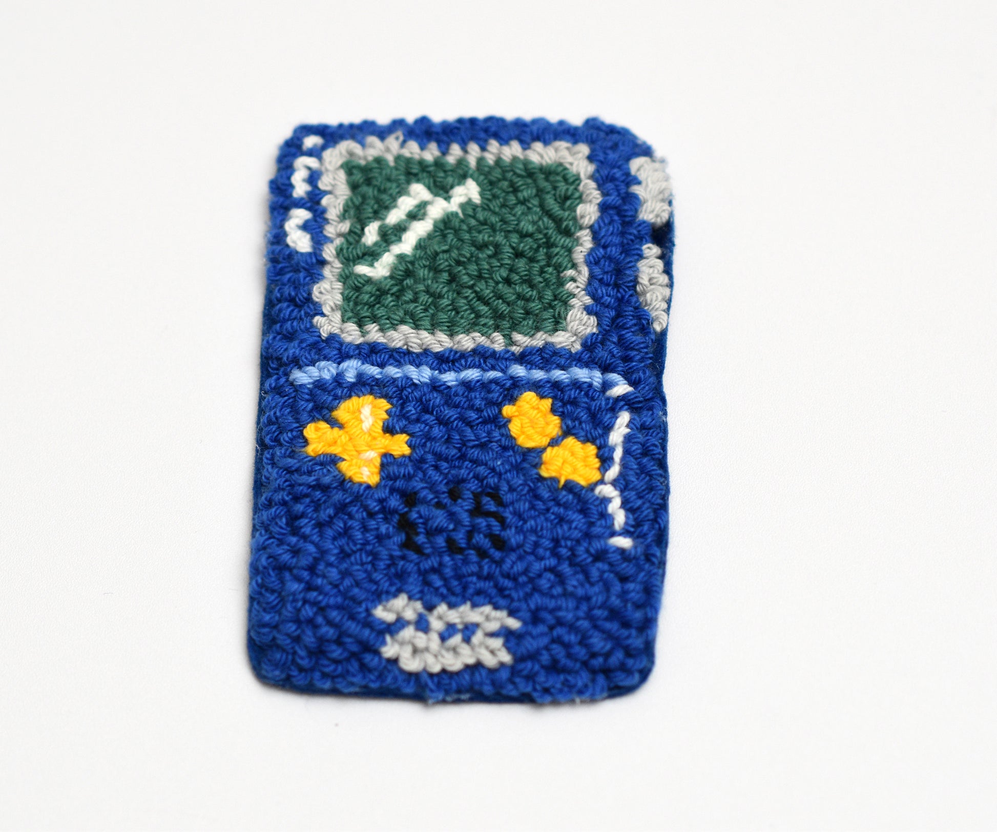 Punch needle blue Game boy coaster with a screen design on a white background