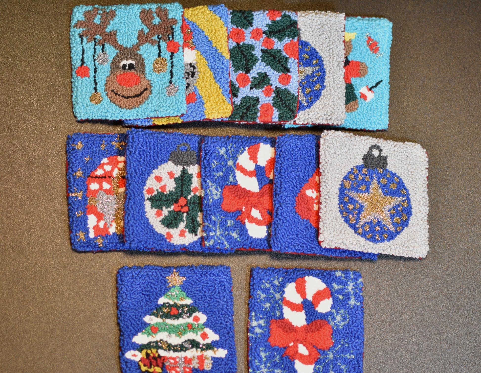 Several punch needle mug rugs on the table