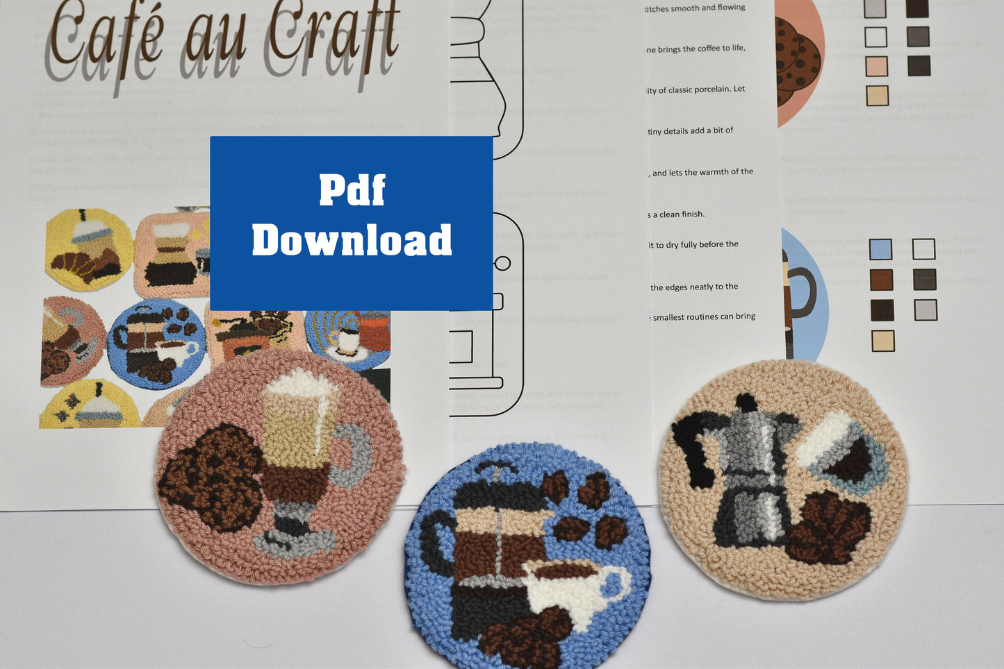 Embroidered coasters with coffee-themed designs on a printed pattern sheet.