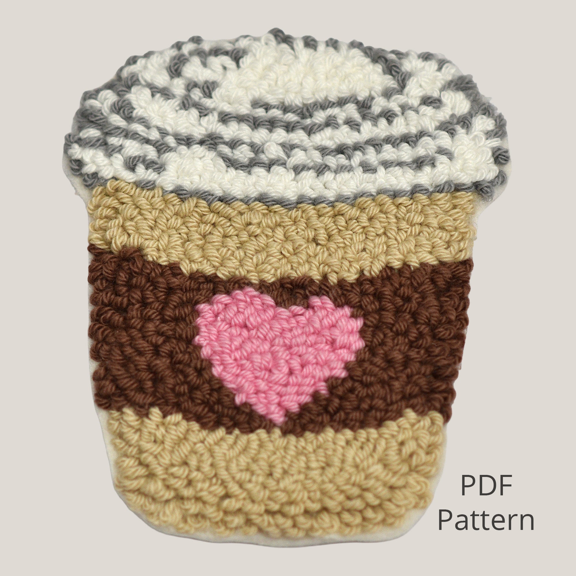 Beginner punch needle coffee cup pattern showing a handmade to-go cup design with a heart detail. Digital PDF pattern suitable for coasters and small punch needle projects.