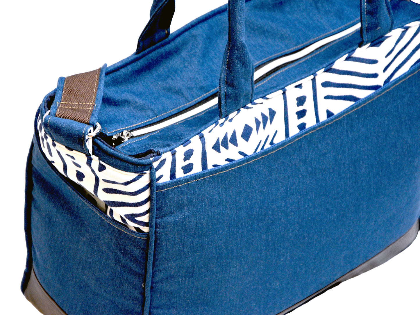 Blue Tote bag with zebra pattern lining on a white background