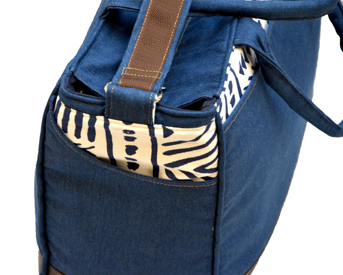 Blue bag with zebra print pocket on a white background