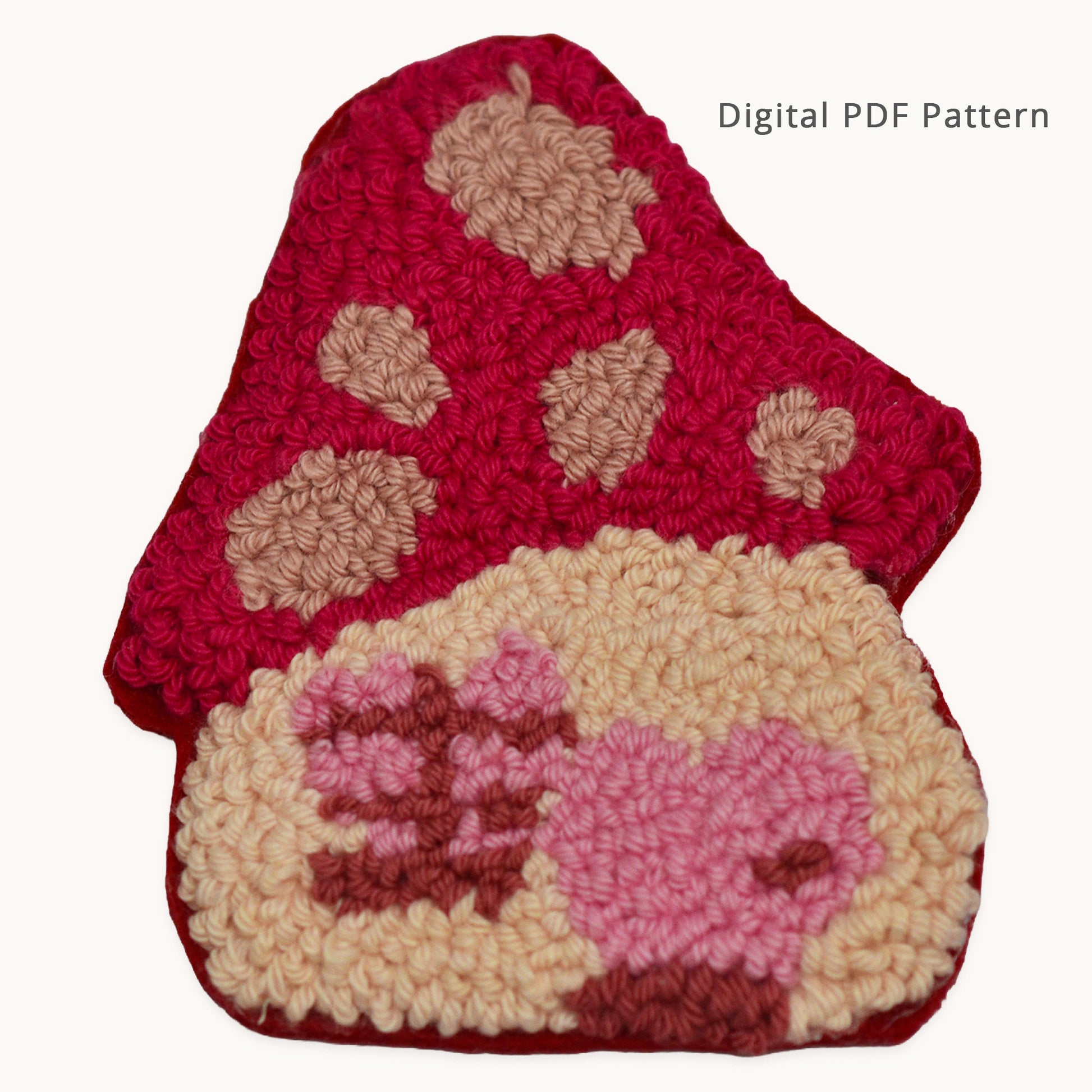 Pink mushroom house punch needle coaster pattern digital download. Handmade-style coaster shaped like a mushroom house with a pink spotted cap, cream-colored house base, pink door, and window details. Beginner-friendly punch needle PDF pattern for creating a whimsical mushroom-themed coaster.