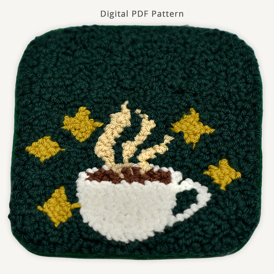 Punch needle coffee cup coaster digital PDF pattern featuring a steaming white coffee cup with golden stars on a dark green background, beginner-friendly punch needle coaster design with cozy café aesthetic.