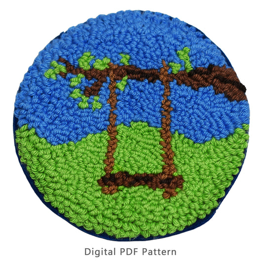 Punch needle digital PDF pattern featuring a spring scene with a swing hanging from a tree branch over green grass and blue sky.