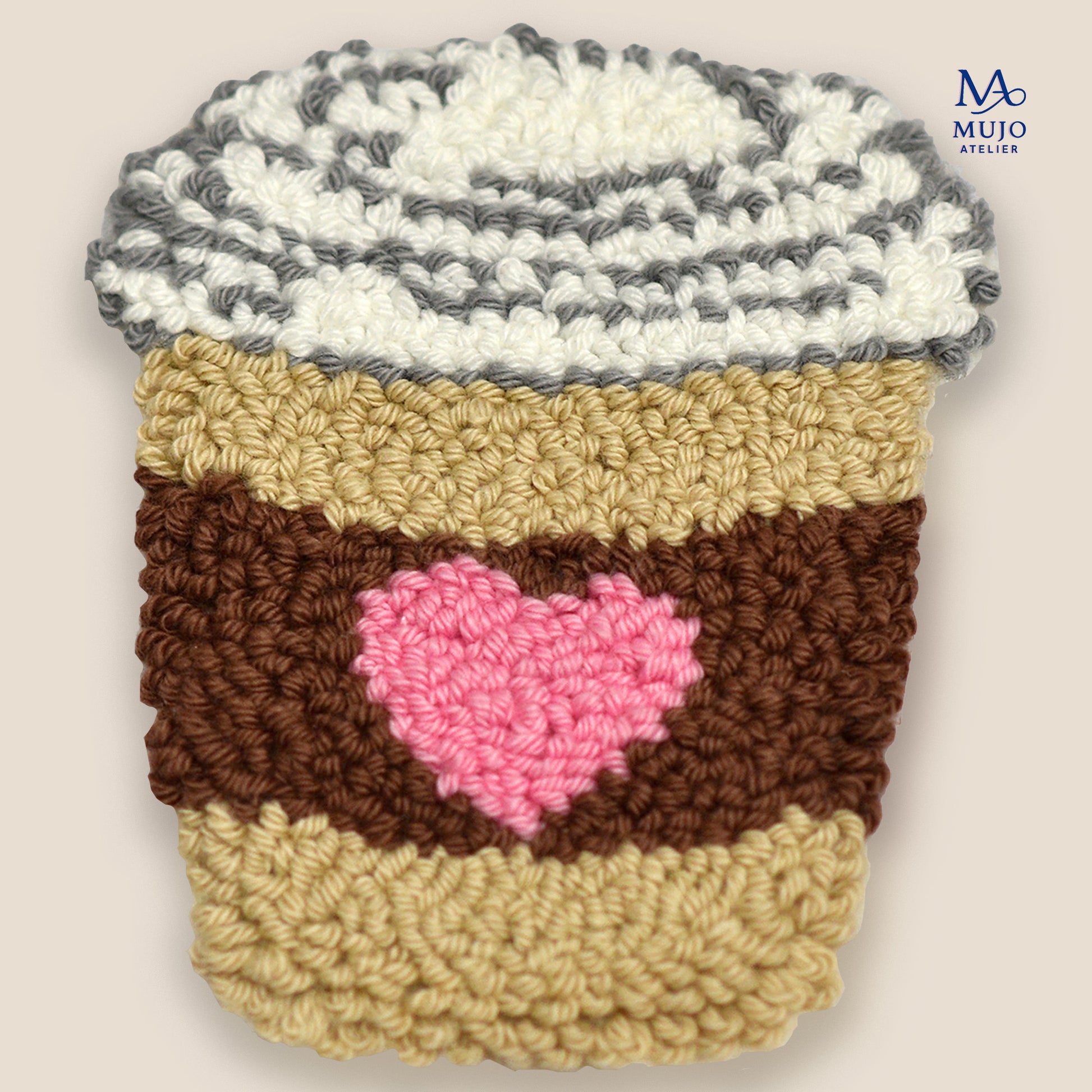 Punch needle coffee cup coaster pattern with pink heart sleeve, digital PDF embroidery design for beginners on a neutral background.