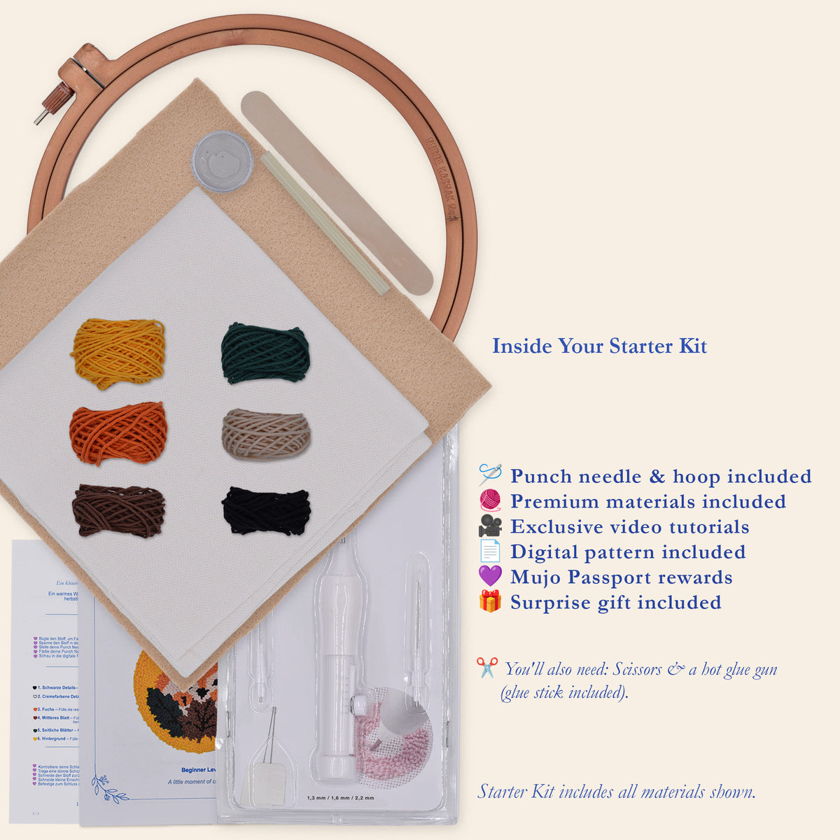 Embroidery starter kit laid out on a cream background, including a wooden hoop, white fabric, multiple colored thread balls, a nail file, a clear plastic case with pnch needle, printed instructions, and promotional text describing included materials and digital content.