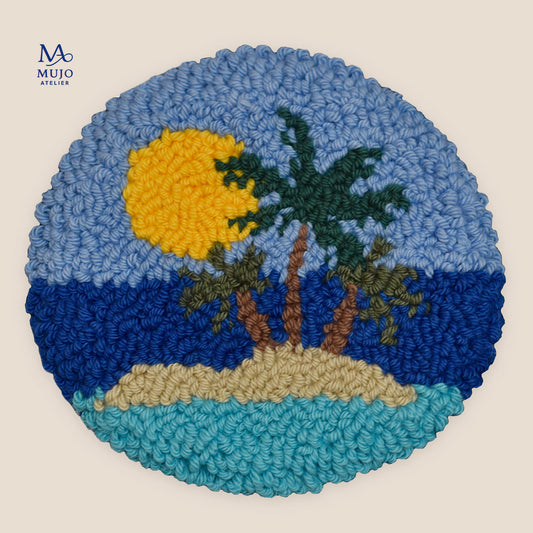 Punch needle coaster featuring a tropical island with palm trees, golden sun, sandy shore, and layered blue ocean under a soft blue sky.