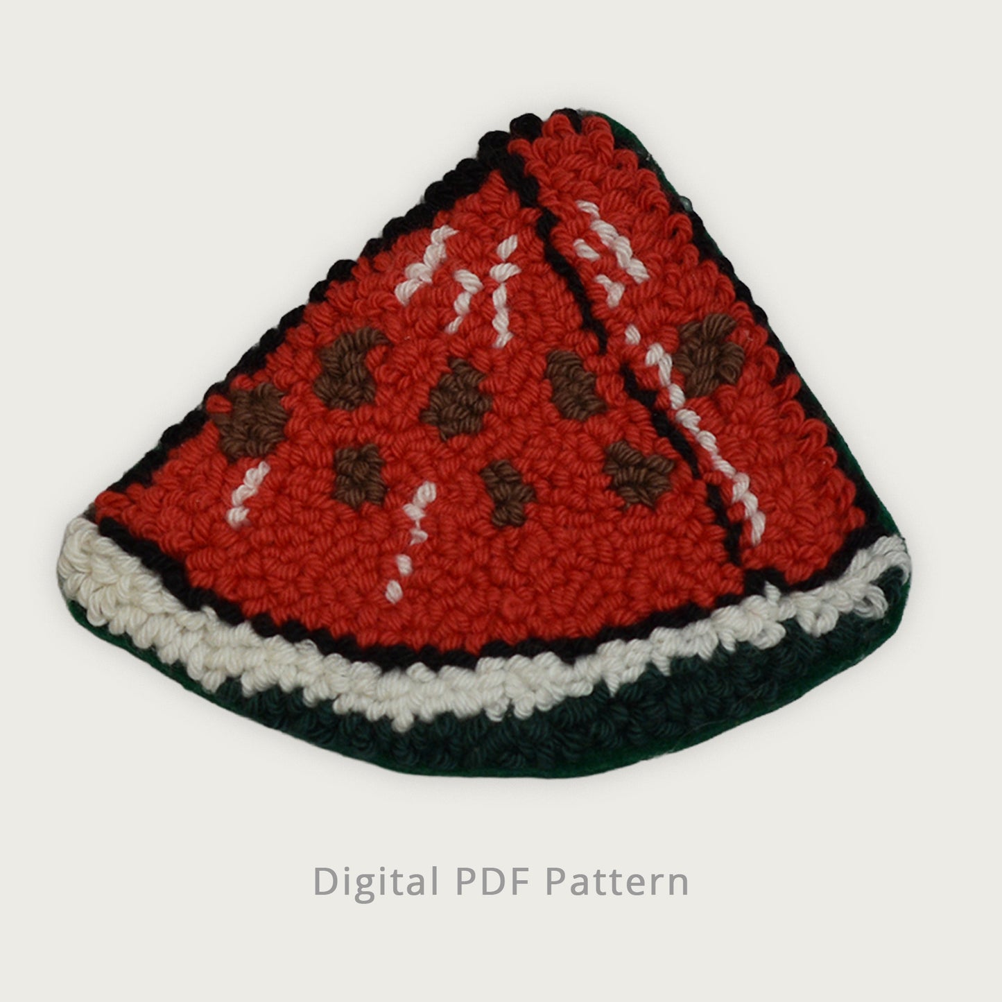 Hand-tufted watermelon slice punch needle coaster with rich red texture, stitched seeds, and green rind, shown on a soft retro cream background as a digital PDF pattern.