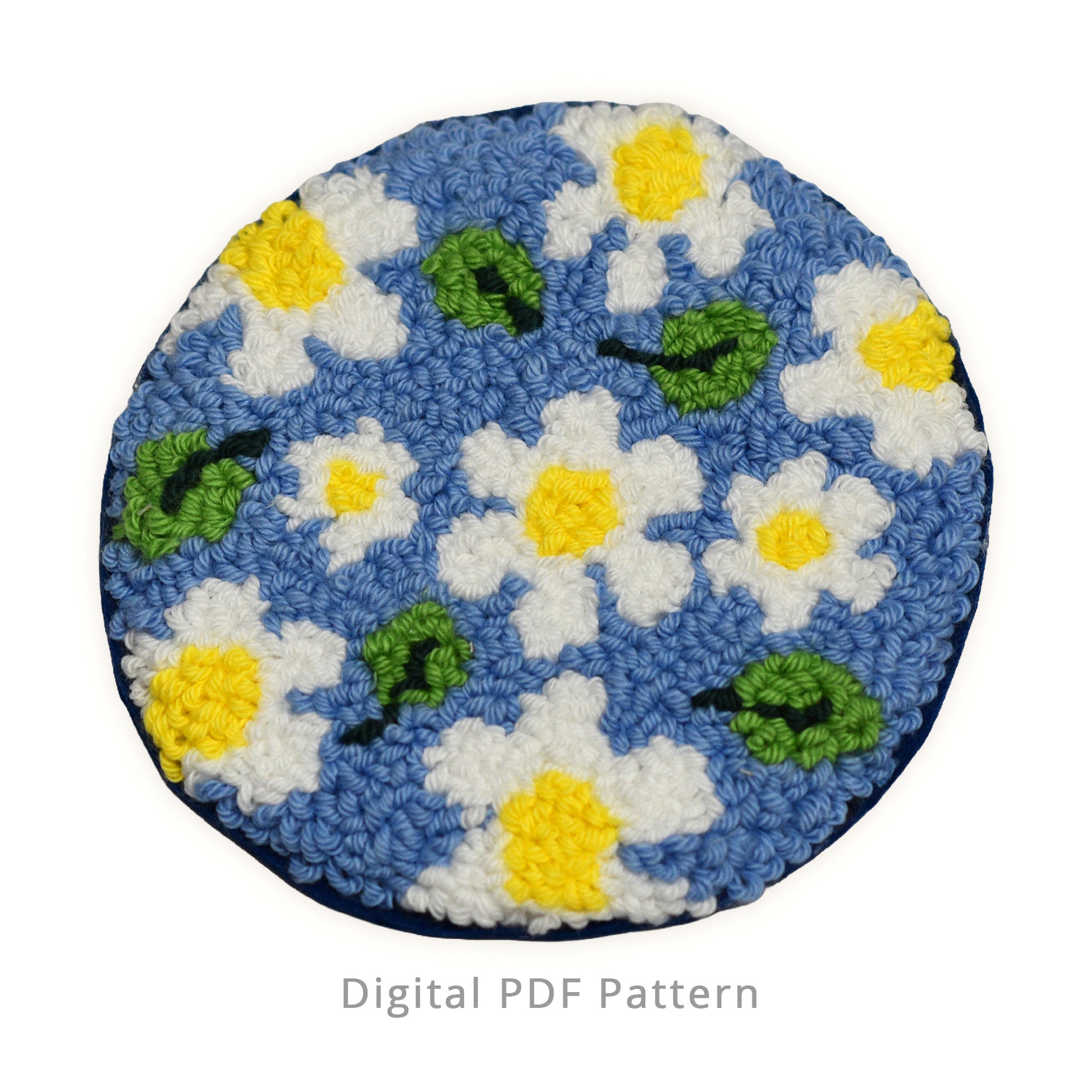 Punch needle daisy coaster pattern featuring white and yellow daisies scattered on a soft blue background, inspired by gentle summer rain, handmade texture shown, digital PDF pattern.