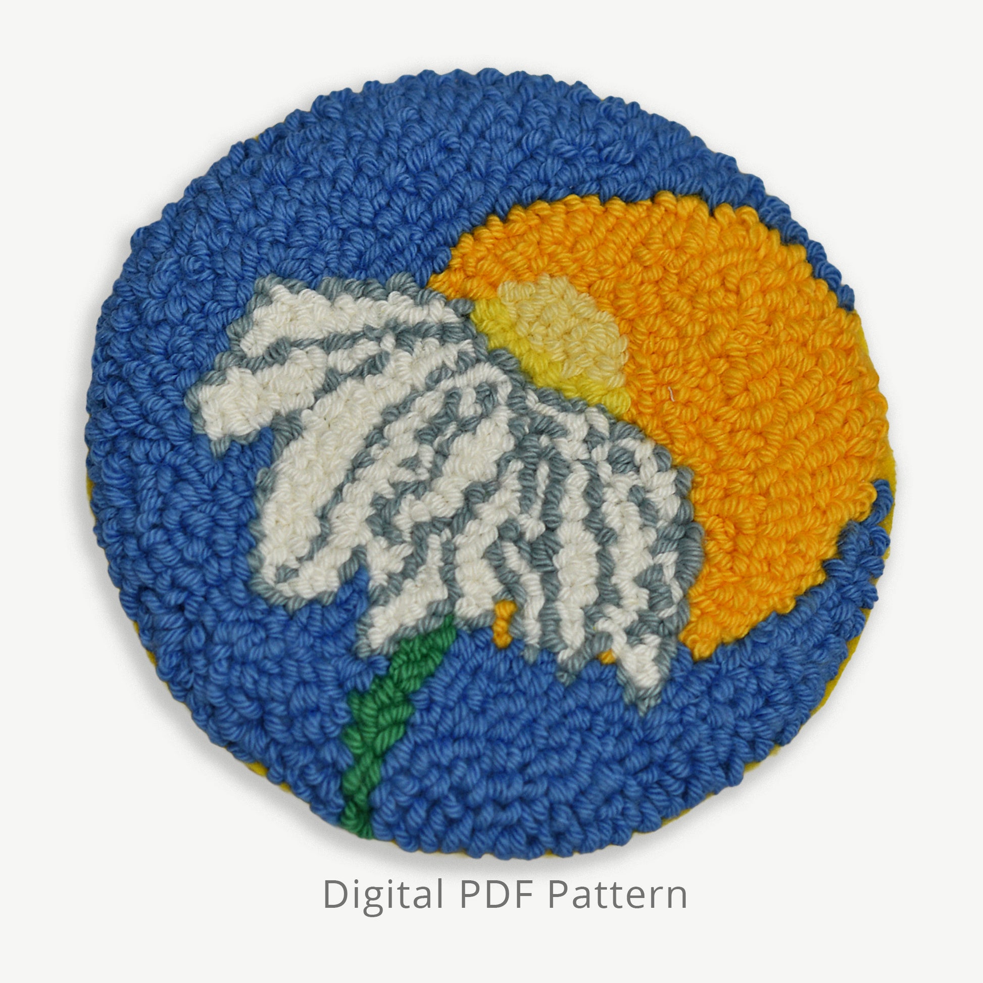 Punch needle daisy flower coaster with yellow sun on blue background, handmade embroidery texture, beginner punch needle PDF pattern