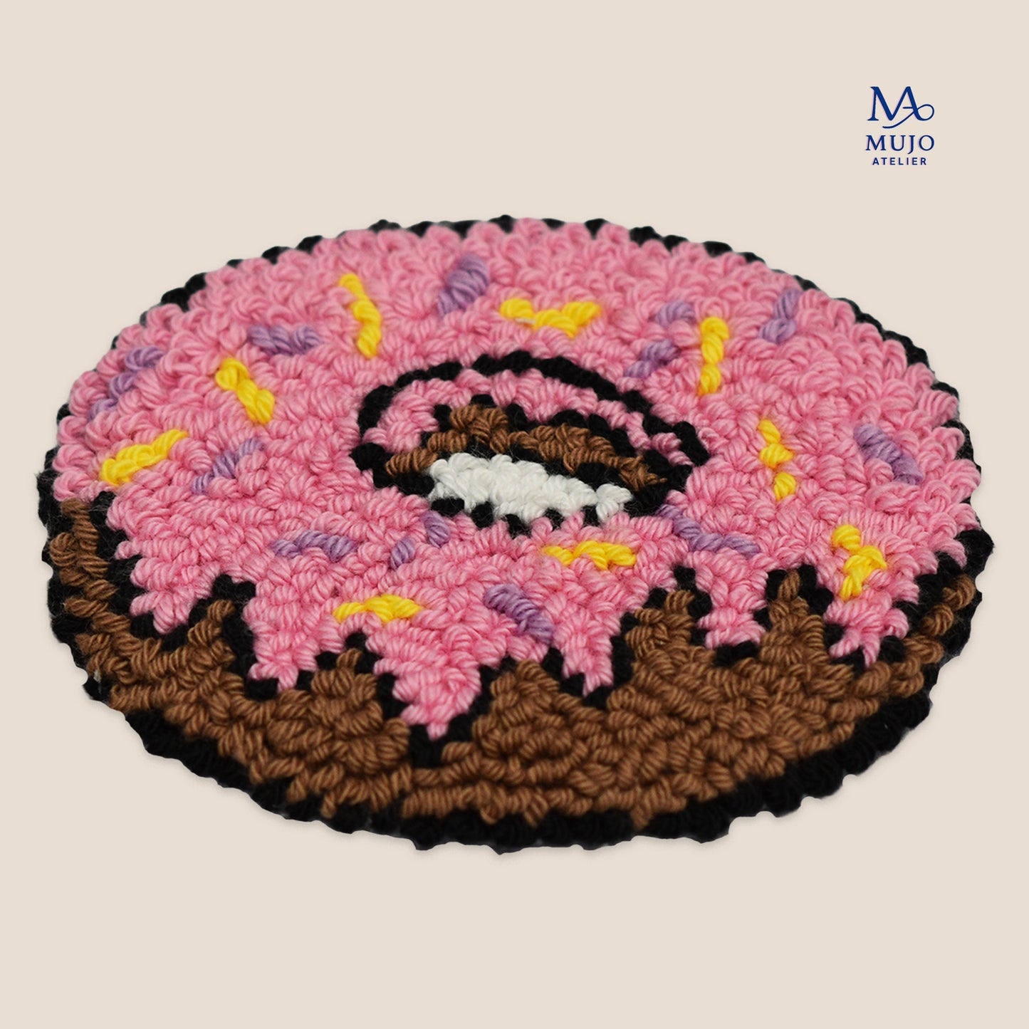 Punch needle donut coaster pattern PDF with pink frosting and colorful sprinkles, beginner-friendly digital embroidery pattern by Mujo Atelier.